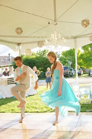 Hoopes Events | Aspyn and Steven | Bear Lake Utah | Groomsman and Bridesmaid Dancing Under Seashell Ornaments Aspyn_Steven_Bear_Lake_Utah_Groomsman_Bride_Dancing.jpg