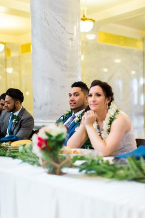 Hoopes Events | Tessa and Taani | Utah State Capitol | Salt Lake City Utah | Bride and Groom Seated at Head Table Tessa_Taani_Utah_State_Capitol_Salt_Lake_City_Utah_Happy_Bride_Groom_Seated_at_Head_Table.jpg