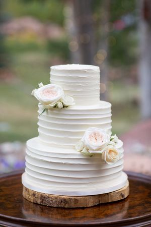 Hoopes Events | Evelyn and Kevin | Park City Utah | Wedding Cake Delicately Adorned with White Roses Evelyn_Kevin_Park_City_Utah_Wedding_Cake_Delicately_Adorned_With_White_Roses.jpg