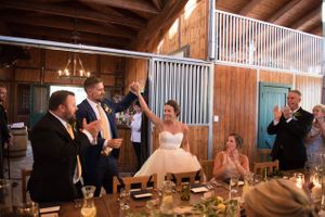 Hoopes Events | Chelsea and Walker | Red Cliff Ranch | Heber City Utah | Couple's Entrance at Reception Dinner in the Barn Chelsea_Walker_Red_Cliff_Ranch_Heber_City_Utah_Couple's_Entrance_Reception_Dinner.jpg