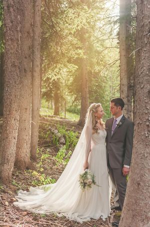 Leaning Against Tree Bride and Groom