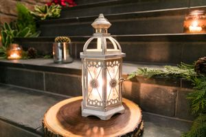 Glowing Lantern on Wooden Charger Rehearsal Dinner