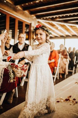 Flower Girl Walks Down the Aisle Ring Ceremony