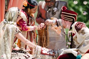 Hoopes Events | Reema and Spencer | Temple Har Shalom | Park City Utah | Bride and Groom Connected by Gold Chain Reema_Spencer_Temple_Har_Shalom_Park_City_Utah_Gold_Chain_Connection.jpg