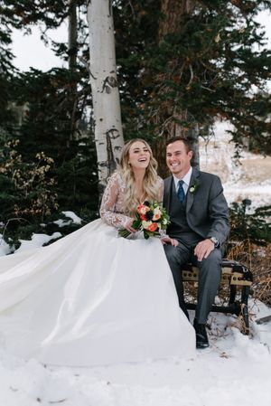 Hoopes Events | Rocky Mountain Bride | Winter Elopement | Deer Valley | Empire Lodge | Park City Utah | Warm, Laughing Couple in the Chilly Air Seated on Bench Rocky_Mountain_Bride_Winter_Elopement_Deer_Valley_Empire_Lodge_Deer_Valley_Resort_Park_City_Utah_Warm_Laughing_Couple_Chilly_Air.jpg