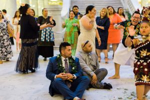Hoopes Events | Tessa and Taani | Utah State Capitol | Salt Lake City Utah | Groom with Leis Seated on Floor Tessa_Taani_Utah_State_Capitol_Salt_Lake_City_Utah_Groom_Seated_on_Floor_With_Leis.jpg