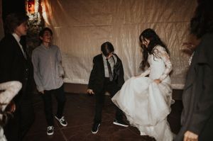 Bride and Groom Dancing With Wedding Guests Reception