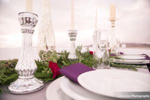 Salt_Air_Wedding_Shoot_Saltair_Resort_Salt_Lake_City_Utah_Elegant_Table_Setting_Silver_Candlesticks_Stormy_Background.jpg