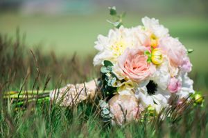 Hoopes Events | Katelyn and David | Park City Utah | Bride's Bouquet Dropped in Grass Katelyn_David_Park_City_Utah_Bride's_Bouquet_Grass.jpg