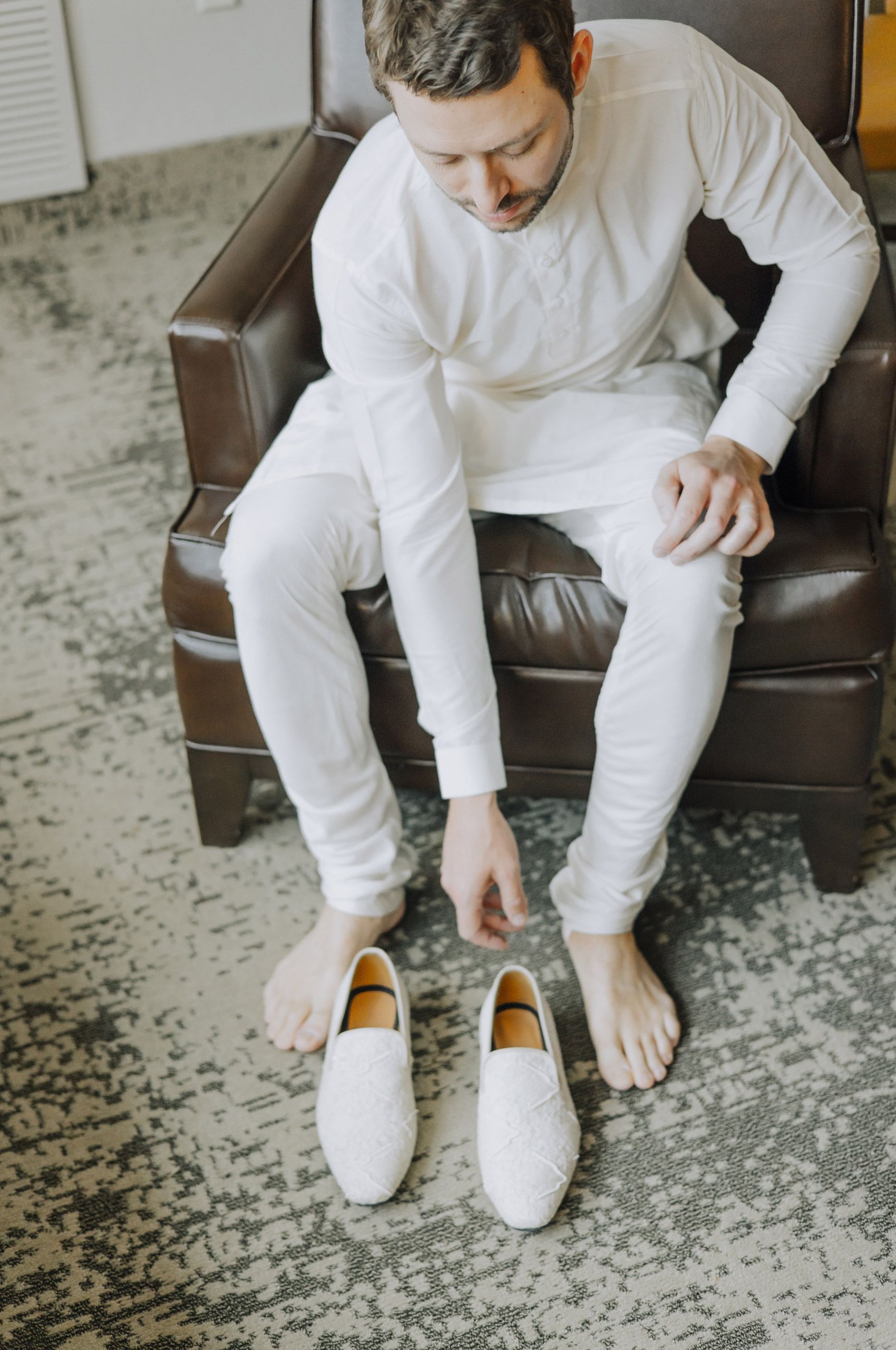 Groom Putting on Shoes Details