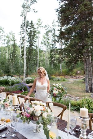 Hoopes Events | Evelyn and Kevin | Park City Utah | Bride Admiring Elegant Table Setting Evelyn_Kevin_Park_City_Utah_Bride_Admiring_Elegant_Table_Setting.jpg