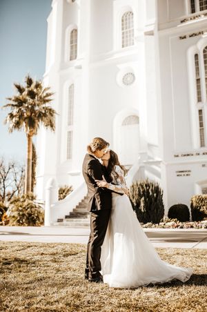Bride and Groom Kiss Outside Beautiful White Temple Ceremony