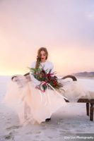 Salt_Air_Wedding_Shoot_Saltair_Resort_Salt_Lake_City_Utah_Bride_Sitting_on_Fainting_Couch_with_Bouquet.jpg