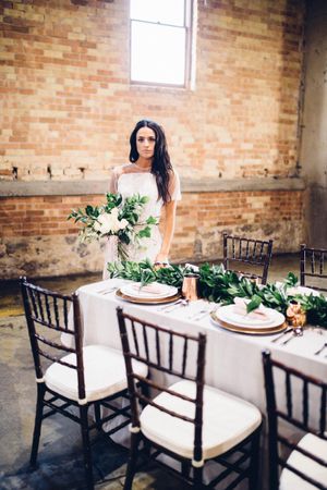 Hoopes Events | Modern Industrial Shoot | The Historic Startup Building | Provo Utah | Bride in Old Warehouse Behind Elegant Table Modern_Industrial_Wedding_Shoot_The_Historic_Startup_Building_Provo_Utah_Bride_Warehouse_Table_Setting.jpg