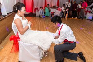 Groom Tries To Find Garter Reception