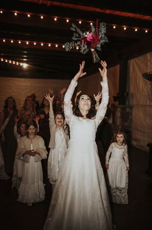 Bouquet Toss With Flowers Girls and Guests Reception