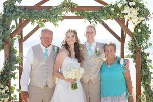 Hoopes Events | Aspyn and Steven | Bear Lake Utah | Family Picture in Front of Flower-Adorned Wooden Arch Aspyn_Steven_Bear_Lake_Utah_Family_Picture.jpg