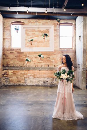 Hoopes Events | Modern Industrial Shoot | The Historic Startup Building | Provo Utah | Beautiful Bride with Hanging Vase Backdrop Modern_Industrial_Wedding_Shoot_The_Historic_Startup_Building_Provo_Utah_Beautiful_Bride_Hanging_Vase_Backdrop.jpg