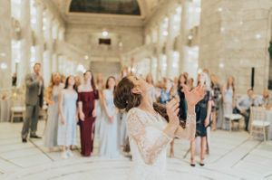 Wedding guests get ready for bouquet toss Reception