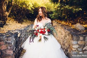 Contemplative Bride by Stone Wall Bride