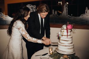 Bride and Groom Cutting Naked Cake Reception