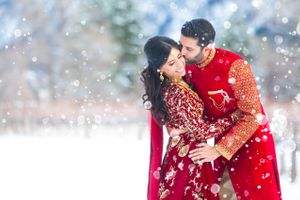 Couple Kissing in a Winter Wonderland Pre-Ceremony