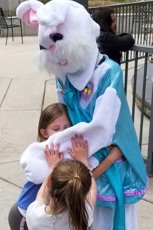 Girls Giving Easter Bunny Hugs Children's Activities