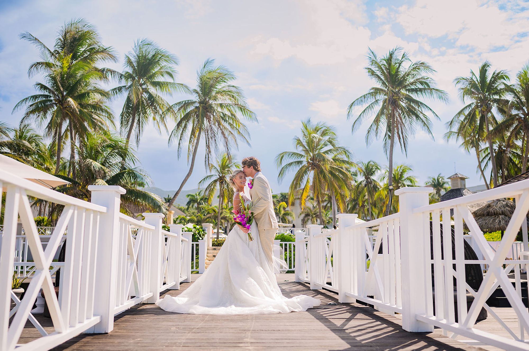 Bride and Groom Kissing on Pier