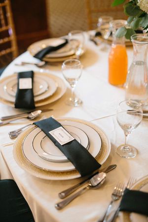 Hoopes Events | Chloe and Austin | Ben Lomond Suites | Ogden Utah | The Great Gatsby Wedding | Detail of Silver-Rimmed Plates with Black Napkins Chloe_Austin_Ben_Lomond_Suites_Ogden_Utah_Great_Gatsby_Place_Setting_Detail_Silver_Rimmed_Plates.jpg