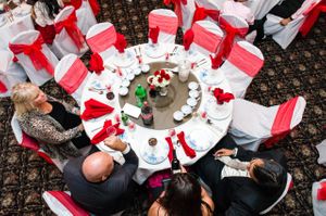 Aerial View of Tablescape, Red Napkins and Sashes Reception