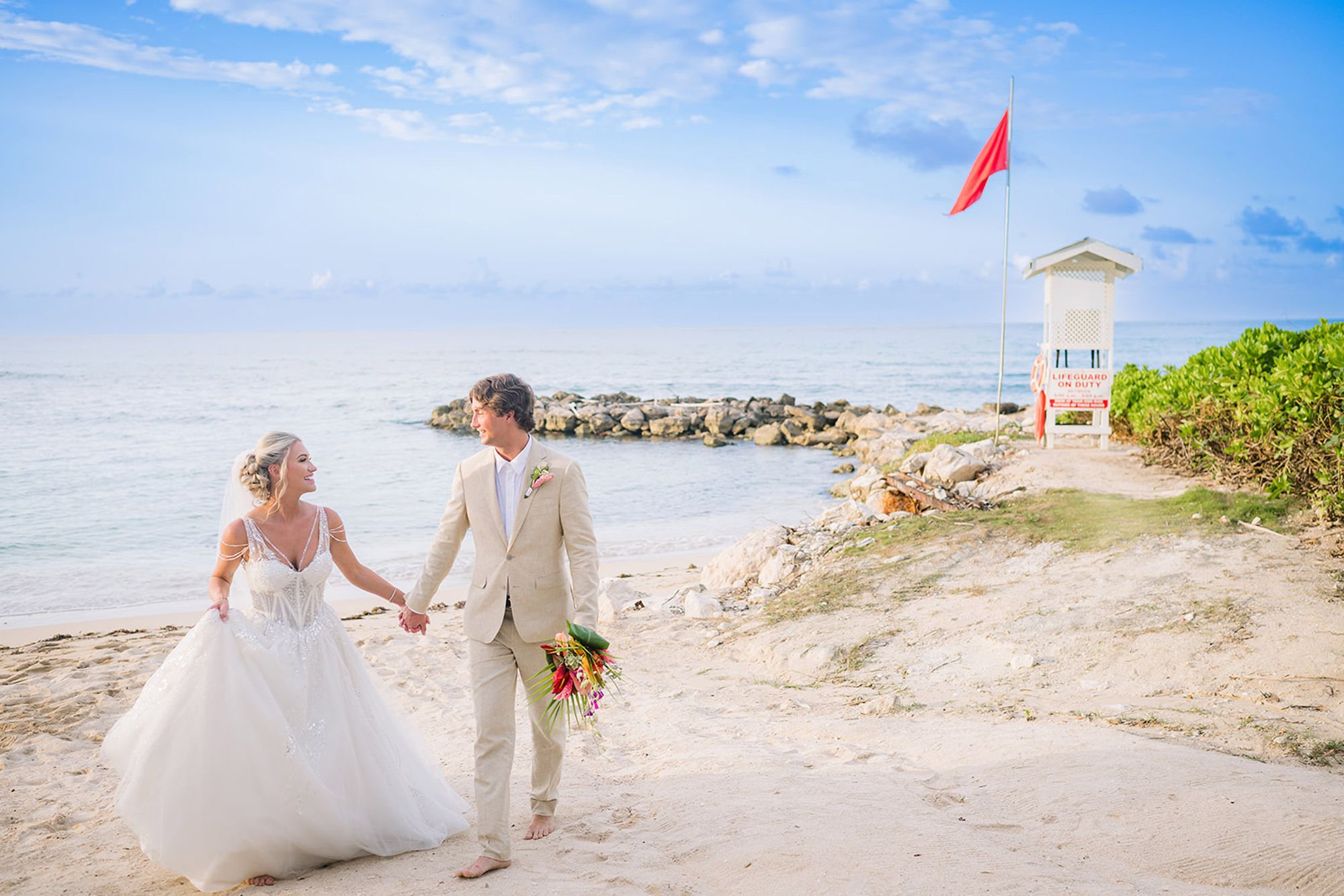 Bride and Groom Walking on Beach